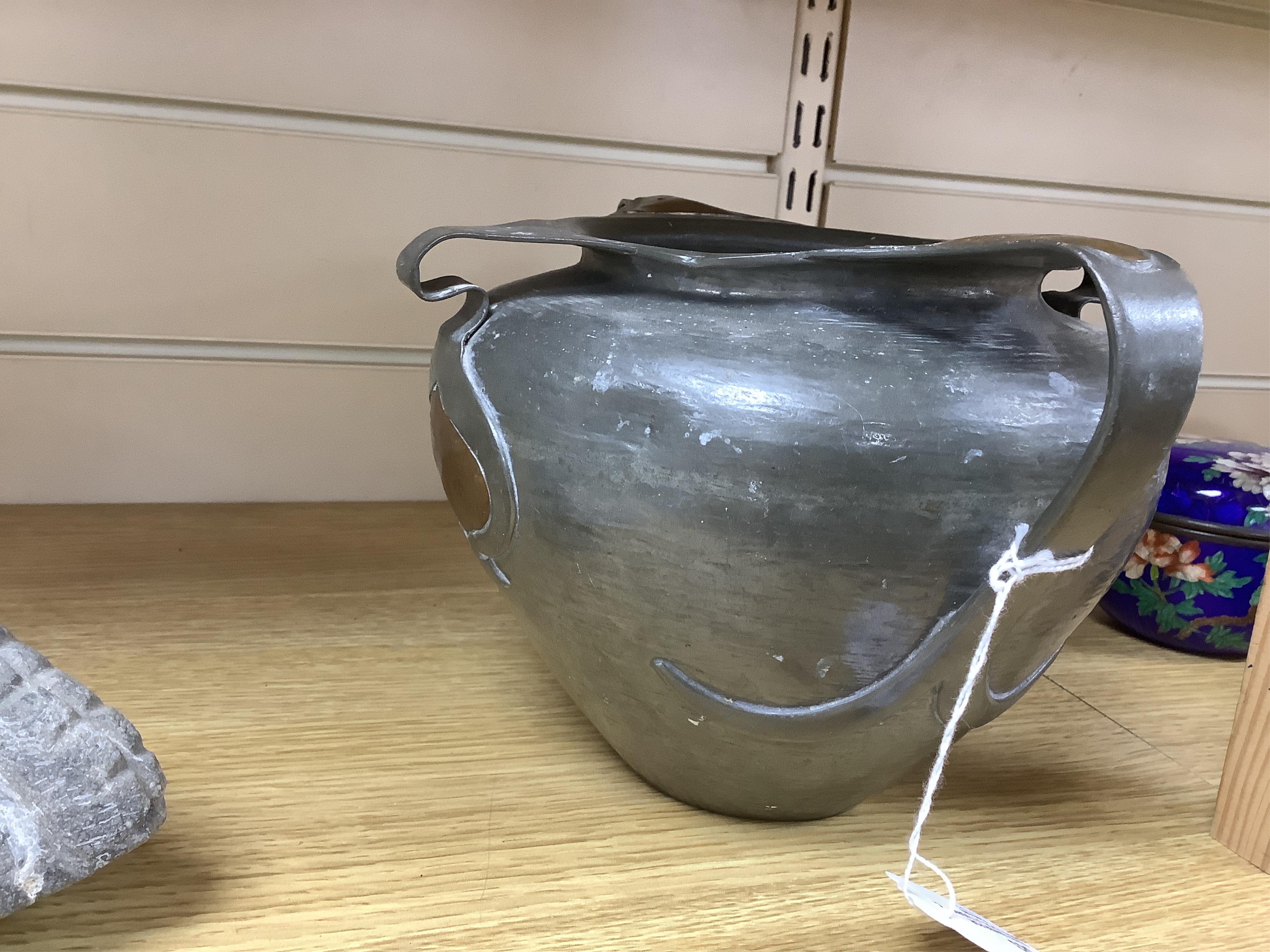 Oliver Baker for Liberty & Co, a Tudric pewter and copper vase, no.0864, c.1910, 25cm wide. Condition - fair to good